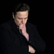 Elon Musk looking pensive against a black backdrop